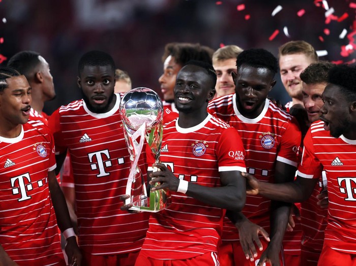 LEIPZIG, GERMANY - JULY 30: Sadio Mane of Bayern Munich celebrates with the Supercup trophy after the final whistle of the Supercup 2022 match between RB Leipzig and FC Bayern München at Red Bull Arena on July 30, 2022 in Leipzig, Germany. (Photo by Martin Rose/Getty Images)