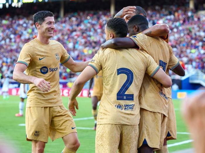 DALLAS, TX - JULY 26: Barcelona forward Robert Lewandowski (#12) and teammates celebrate after a goal during the Soccer Champions Tour match between Juventus and FC Barcelona on July 26, 2022 at the Cotton Bowl Stadium in Dallas, TX. (Photo by  Matthew Visinsky/Icon Sportswire via Getty Images)