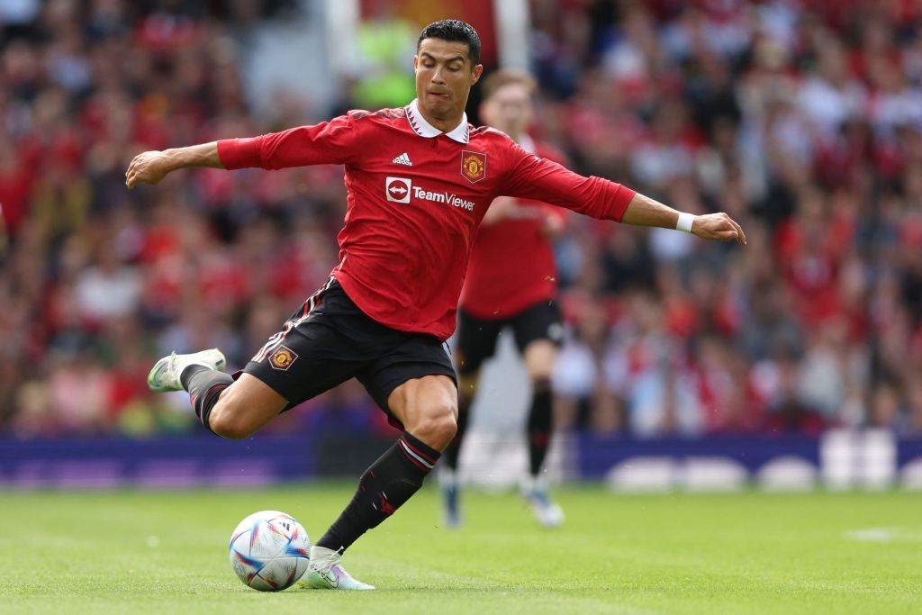 Manchester United's Portuguese striker Cristiano Ronaldo passes the ball during a pre-season club friendly football match between Manchester United and Rayo Vallecano at Old Trafford in Manchester, north west England, on July 31, 2022. (Photo by Nigel Roddis / AFP) (Photo by NIGEL RODDIS/AFP via Getty Images)