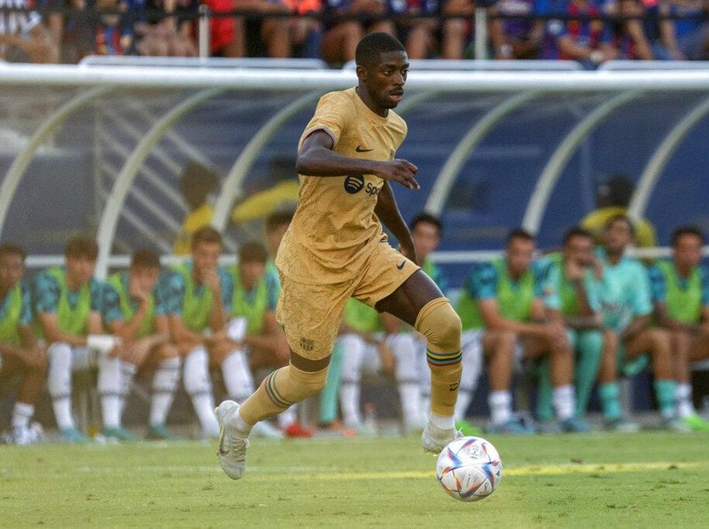 Barcelona forward Ousmane Dembélé dribbles the ball during the first half of a soccer match against Juventus at the Cotton Bowl, Tuesday, July 26, 2022 in Dallas. The game ended in a 2-2 draw. (AP Photo/Jeffrey McWhorter)