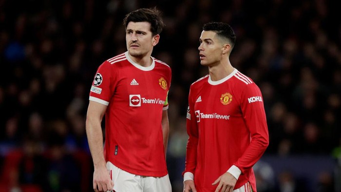 MANCHESTER, UNITED KINGDOM - MARCH 15: (L-R) Harry Maguire of Manchester United, Cristiano Ronaldo of Manchester United 
 during the UEFA Champions League  match between Manchester United v Atletico Madrid at the Old Trafford on March 15, 2022 in Manchester United Kingdom (Photo by David S. Bustamante/Soccrates/Getty Images)
