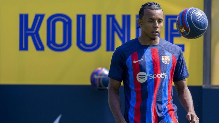 French defender Jules Kounde controls the ball during the official presentation after signing for FC Barcelona in Barcelona, Spain, Monday, August. 1, 2022.  (AP Photo/Joan Monfort)