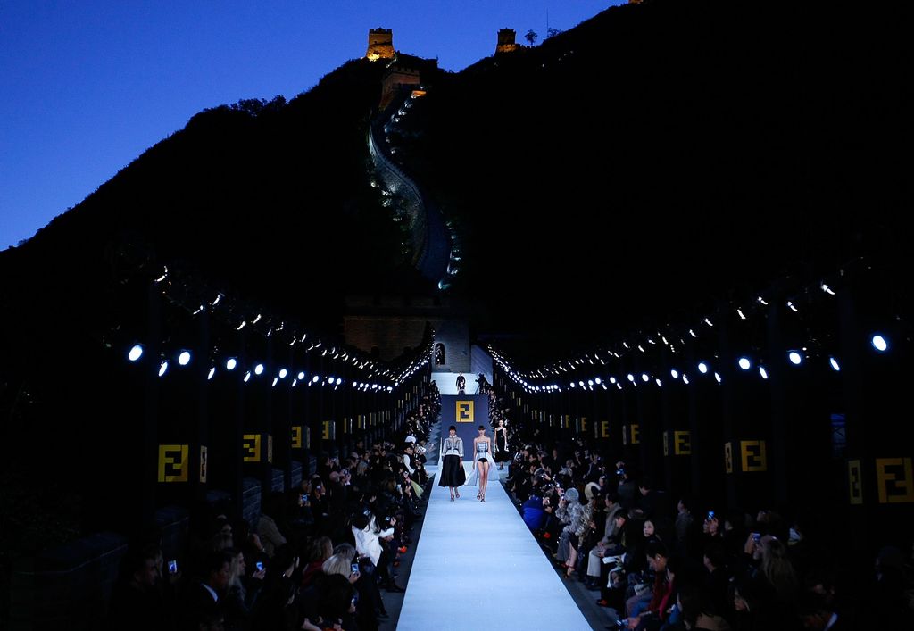 Caption: BEIJING - OCTOBER 19: Models walk the runway with designer Karl Lagerfeld's Fall/Winter 2007 collection at the Fendi Great Wall of China fashion show taking place on the Great Wall of China itself, on October 19, 2007 in Beijing, China. (Photo by Lucas Dawson/Getty Images for FENDI)