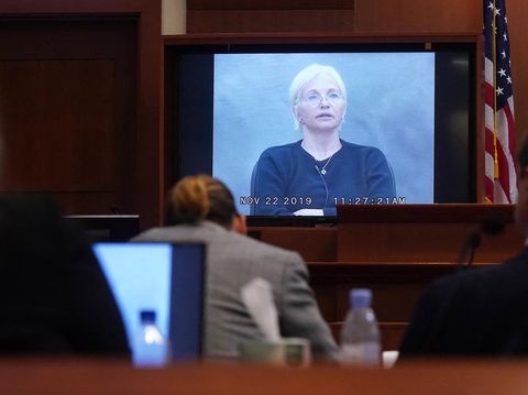 Ellen Barkin Johnny Depp US actor Ellen Barkin appears on a monitor as a recorded testimony from 2019 is played during the 50 million US dollar Depp vs Heard defamation trial at the Fairfax County Circuit Court in Fairfax, Virginia, on May 19, 2022. - Actor Johnny Depp is suing ex-wife Amber Heard for libel after she wrote an op-ed piece in The Washington Post in 2018 referring to herself as a public figure representing domestic abuse. (Photo by Shawn THEW / POOL / AFP)