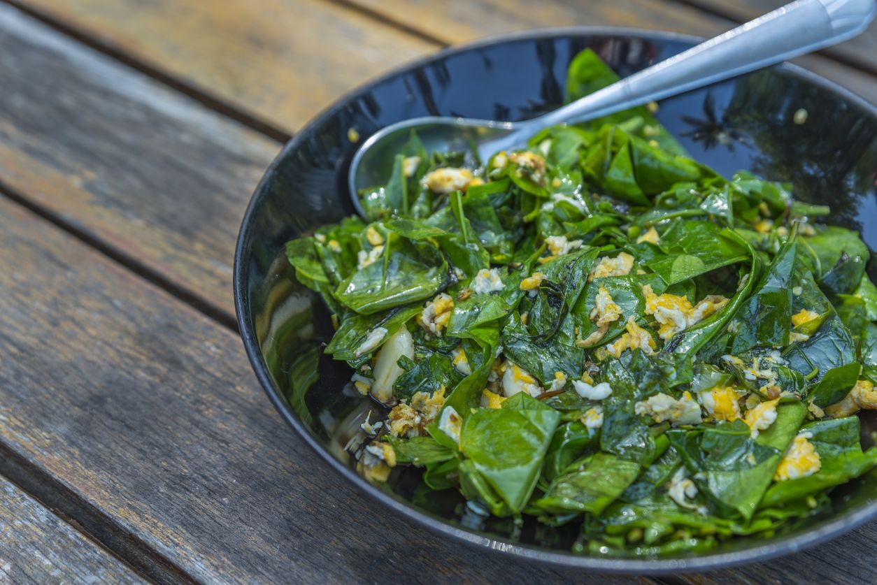 Healthy Thailand food, called Bai Liang Pad Kai or Stir fried Gnetum gnemon or melinjo stire fried with egg.