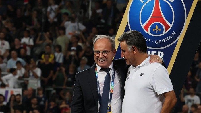 Luis Campos (L), Portuguese Football Advisor for French club Paris Saint-Germain, celebrates with Paris Saint-Germains French head coach Christophe Galtier after the team won the French Champions Trophy (Trophee des Champions) final football match, Paris Saint-Germain versus FC Nantes, in the at the Bloomfield Stadium, in Tel Aviv on July 31, 2022. - Paris Saint-Germain (PSG) beat Nantes 4-0 to clinch the trophy. (Photo by JACK GUEZ / AFP) (Photo by JACK GUEZ/AFP via Getty Images)