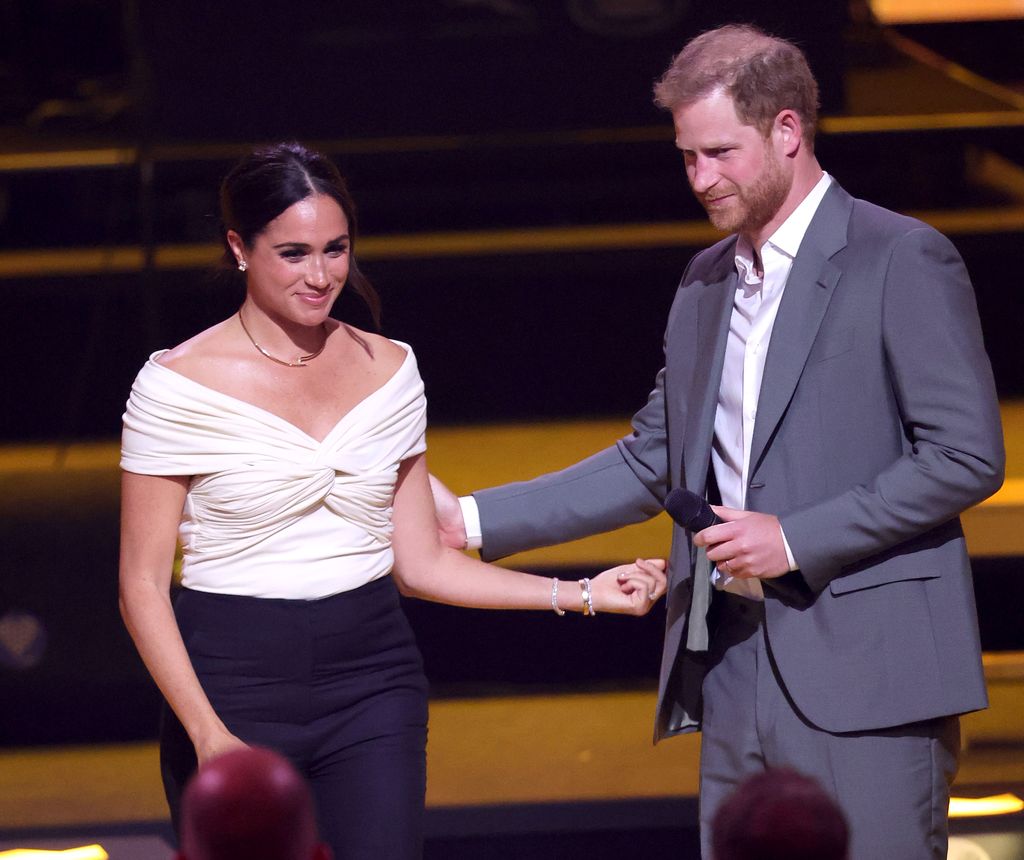 THE HAGUE, NETHERLANDS - APRIL 16: Prince Harry, Duke of Sussex and Meghan, Duchess of Sussex on stage during the Invictus Games The Hague 2020 Opening Ceremony at Zuiderpark on April 16, 2022 in The Hague, Netherlands. (Photo by Chris Jackson/Getty Images for the Invictus Games Foundation )