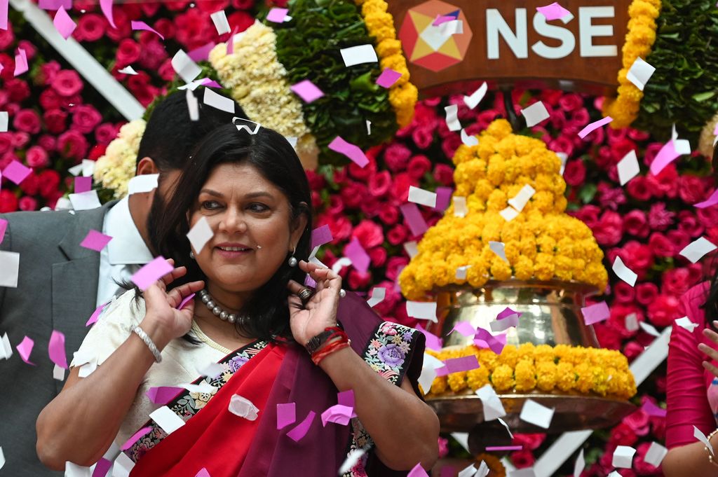 Falguni Nayar, managing director and CEO of Nykaa, an online marketplace for beauty and wellness products, attends the company's IPO listing ceremony at the National Stock Exchange in Mumbai on November 10, 2021. (Photo by Punit PARANJPE / AFP) (Photo by PUNIT PARANJPE/AFP via Getty Images)