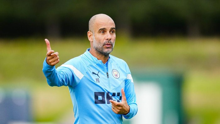 MANCHESTER, ENGLAND - AUGUST 02: Manchester Citys Pep Guardiola in action during training at Manchester City Football Academy on August 2, 2022 in Manchester, England. (Photo by Tom Flathers/Manchester City FC via Getty Images)