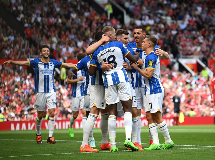 MANCHESTER, ENGLAND - AUGUST 07: Pascal Gross of Brighton & Hove Albion celebrates with teammates after scoring their team's first goal  during the Premier League match between Manchester United and Brighton & Hove Albion at Old Trafford on August 07, 2022 in Manchester, England. (Photo by Michael Regan/Getty Images)