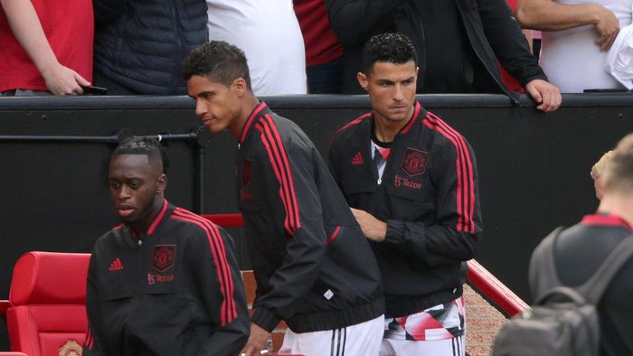 Manchester United's Cristiano Ronaldo (right) takes his seat on the bench before the Premier League match at Old Trafford, Manchester. Picture date: Sunday August 7, 2022. (Photo by Ian Hodgson/PA Images via Getty Images)