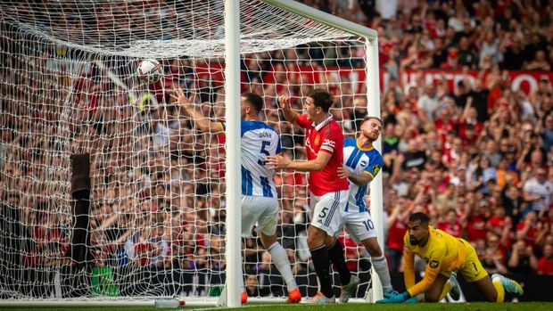 MANCHESTER, ENGLAND - AUGUST 07: Harry Maguire of Manchester United celebrates Diogo Dalot scoring their first goal during the Premier League match between Manchester United and Brighton & Hove Albion at Old Trafford on August 07, 2022 in Manchester, England. (Photo by Ash Donelon/Manchester United via Getty Images)