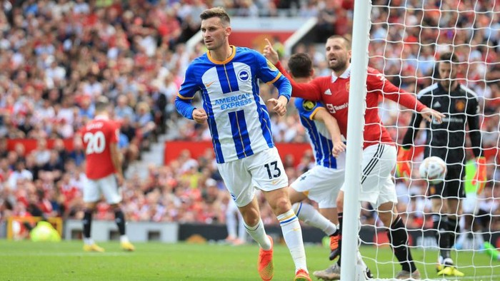 Brightons German midfielder Pascal Gross reacts after scoring his team first goal during the English Premier League football match between Manchester United and Brighton and Hove Albion at Old Trafford in Manchester, north west England, on August 7, 2022. - RESTRICTED TO EDITORIAL USE. No use with unauthorized audio, video, data, fixture lists, club/league logos or live services. Online in-match use limited to 120 images. An additional 40 images may be used in extra time. No video emulation. Social media in-match use limited to 120 images. An additional 40 images may be used in extra time. No use in betting publications, games or single club/league/player publications. (Photo by Lindsey Parnaby / AFP) / RESTRICTED TO EDITORIAL USE. No use with unauthorized audio, video, data, fixture lists, club/league logos or live services. Online in-match use limited to 120 images. An additional 40 images may be used in extra time. No video emulation. Social media in-match use limited to 120 images. An additional 40 images may be used in extra time. No use in betting publications, games or single club/league/player publications. / RESTRICTED TO EDITORIAL USE. No use with unauthorized audio, video, data, fixture lists, club/league logos or live services. Online in-match use limited to 120 images. An additional 40 images may be used in extra time. No video emulation. Social media in-match use limited to 120 images. An additional 40 images may be used in extra time. No use in betting publications, games or single club/league/player publications. (Photo by LINDSEY PARNABY/AFP via Getty Images)