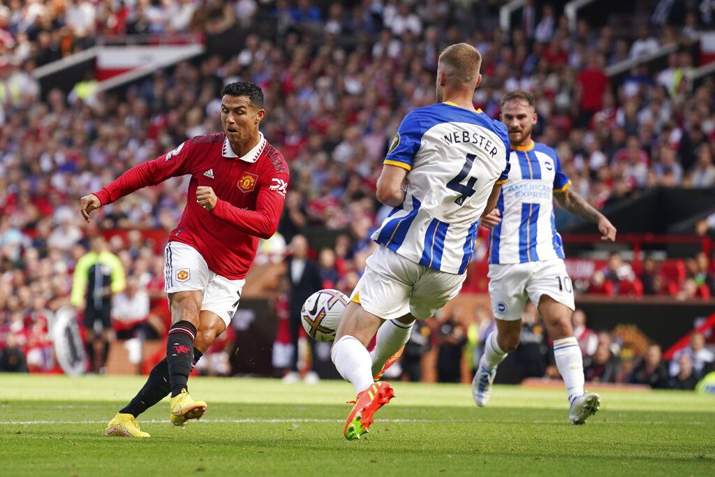 Manchester United' Cristiano Ronaldo, centre, gestures as he sits with teammates,  prior to the start of the English Premier League soccer match between Manchester United and Brighton at Old Trafford stadium in Manchester, England, Sunday, Aug. 7, 2022. (Ian Hodgson/PA via AP)