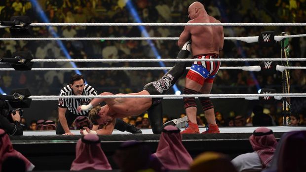 Kurt Angle (R) performs the ankle lock on Dolph Ziggler during the WWE World Cup Quarterfinal match as part of as part of the World Wrestling Entertainment (WWE) Crown Jewel pay-per-view at the King Saud University Stadium in Riyadh on November 2, 2018. (Photo by Fayez Nureldine / AFP)        (Photo credit should read FAYEZ NURELDINE/AFP via Getty Images)