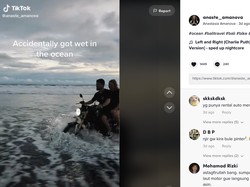 Heboh, Aksi Bule Terjang Ombak Pakai Motor di Bali