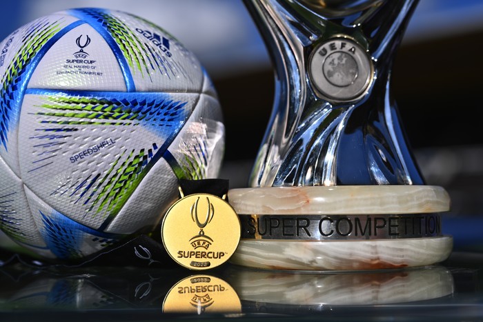 HELSINKI, FINLAND - AUGUST 09: A general view of the UEFA Super Cup Trophy with the medal and the offical matchball seen on display inside the stadium during previews ahead of the UEFA Super Cup Final 2022 at on August 09, 2022 in Helsinki, Finland. (Photo by Oliver Hardt - UEFA/UEFA via Getty Images)