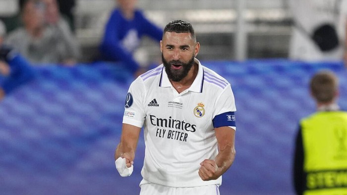 Real Madrids Karim Benzema celebrates after scoring his sides second goal during the UEFA Super Cup final soccer match between Real Madrid and Eintracht Frankfurt at Helsinkis Olympic Stadium, Finland, Wednesday, Aug. 10, 2022. (AP Photo/Antonio Calanni)