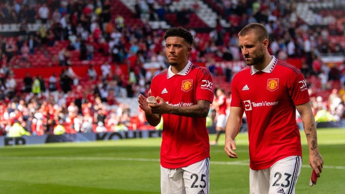 MANCHESTER, ENGLAND - AUGUST 07: Jadon Sancho and Luke Shaw of Manchester United walks off after the Premier League match between Manchester United and Brighton & Hove Albion at Old Trafford on August 07, 2022 in Manchester, England. (Photo by Ash Donelon/Manchester United via Getty Images)