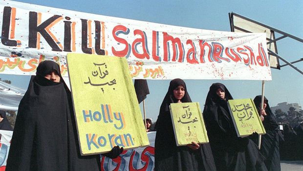 Picture dated 17 February 1989 in Tehran of Iranian women holding banners which read 