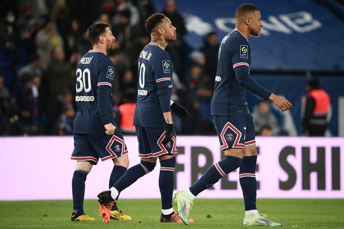 PSG Paris Saint-Germain's Brazilian forward Neymar (C) celebrates with Paris Saint-Germain's French forward Kylian Mbappe (R) and Paris Saint-Germain's Argentinian forward Lionel Messi (L) after scoring the 5-1 goal during the French L1 football match between Paris Saint-Germain (PSG) and FC Lorient at the Parc des Princes stadium in Paris on April 3, 2022. (Photo by FRANCK FIFE / AFP) (Photo by FRANCK FIFE/AFP via Getty Images)