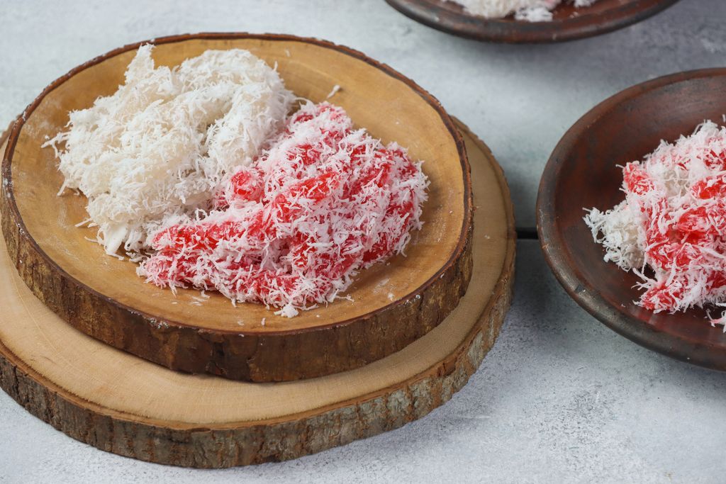 Cenil merah putih, Red and white Cenil, Indonesian traditional snack, made from strach of cassava. These foods can be formed in small rounds. Cenil usually served with grated coconut.