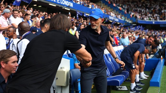 LONDON, ENGLAND - AUGUST 14: Thomas Tuchel, Manager of Chelsea, interacts with Antonio Conte, Manager of Tottenham Hotspur, prior to the Premier League match between Chelsea FC and Tottenham Hotspur at Stamford Bridge on August 14, 2022 in London, England. (Photo by Tottenham Hotspur FC/Tottenham Hotspur FC via Getty Images)