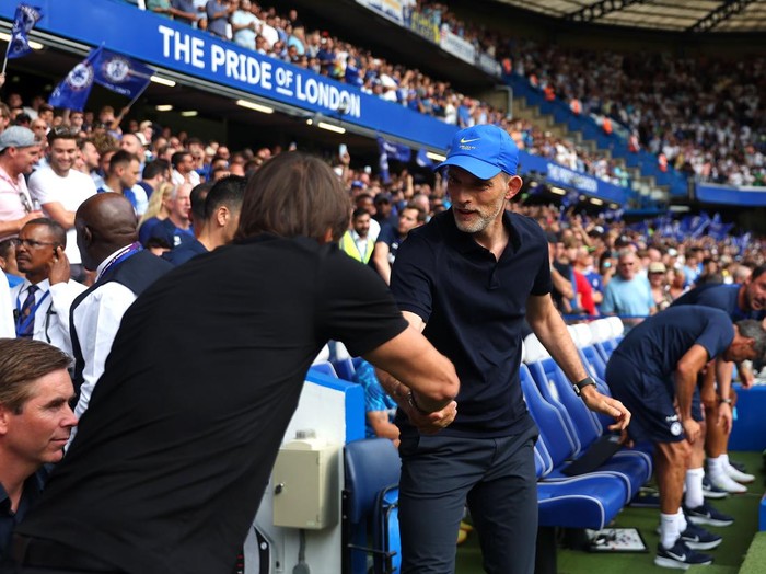 LONDON, ENGLAND - AUGUST 14: Thomas Tuchel, Manager of Chelsea, interacts with Antonio Conte, Manager of Tottenham Hotspur, prior to the Premier League match between Chelsea FC and Tottenham Hotspur at Stamford Bridge on August 14, 2022 in London, England. (Photo by Tottenham Hotspur FC/Tottenham Hotspur FC via Getty Images)