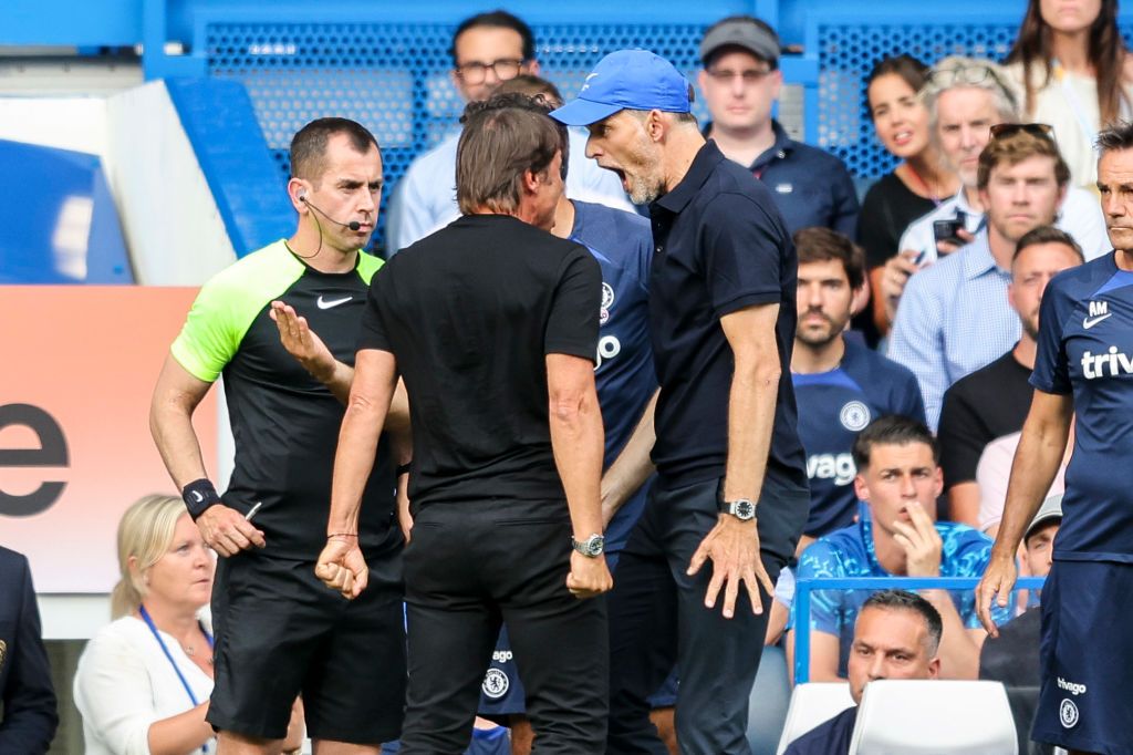 LONDON, ENGLAND - AUGUST 14: Head Coachs' Antonio Conte of Tottenham Hotspur and Thomas Tuchel of Chelsea had to be pulled apart at the end of their sides 2-2 draw and both received red cards from Referee Anthony Taylor during the Premier League match between Chelsea FC and Tottenham Hotspur at Stamford Bridge on August 14, 2022 in London, England. (Photo by Robin Jones/Getty Images)