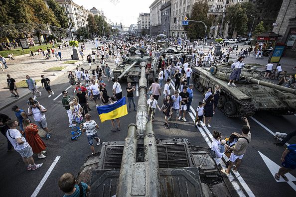 KYIV, UKRAINE - AUGUST 21: Ukrainians arrive at Khreschatyk Street to see the seized military equipment and weapons including tank and motorized artillery systems belonging to the Russian army displayed by Ukraine ahead of the country's 31st anniversary of Independence Day in Kyiv, Ukraine on August 21, 2022. (Photo by Metin Aktas/Anadolu Agency via Getty Images)