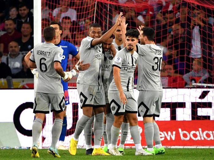 Paris Saint-Germain's French forward Kylian Mbappe (3rdL) celebrates with teammates after scoring his team's sixth goal during the French L1 football match between Lille OSC and Paris-Saint Germain (PSG) at Stade Pierre-Mauroy in Villeneuve-d'Asq, northern France on August 21, 2022. (Photo by FRANCOIS LO PRESTI / AFP) (Photo by FRANCOIS LO PRESTI/AFP via Getty Images)