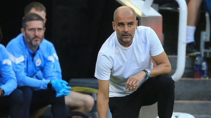 Manchester Citys Spanish manager Pep Guardiola reacts during the English Premier League football match between Newcastle United and Manchester City at St James Park in Newcastle-upon-Tyne, north east England, on August 21, 2022. - RESTRICTED TO EDITORIAL USE. No use with unauthorized audio, video, data, fixture lists, club/league logos or live services. Online in-match use limited to 120 images. An additional 40 images may be used in extra time. No video emulation. Social media in-match use limited to 120 images. An additional 40 images may be used in extra time. No use in betting publications, games or single club/league/player publications. (Photo by Lindsey Parnaby / AFP) / RESTRICTED TO EDITORIAL USE. No use with unauthorized audio, video, data, fixture lists, club/league logos or live services. Online in-match use limited to 120 images. An additional 40 images may be used in extra time. No video emulation. Social media in-match use limited to 120 images. An additional 40 images may be used in extra time. No use in betting publications, games or single club/league/player publications. / RESTRICTED TO EDITORIAL USE. No use with unauthorized audio, video, data, fixture lists, club/league logos or live services. Online in-match use limited to 120 images. An additional 40 images may be used in extra time. No video emulation. Social media in-match use limited to 120 images. An additional 40 images may be used in extra time. No use in betting publications, games or single club/league/player publications. (Photo by LINDSEY PARNABY/AFP via Getty Images)