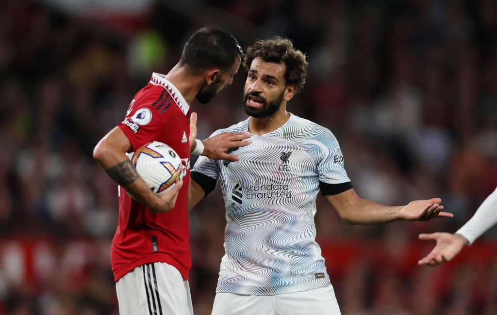 MANCHESTER, ENGLAND - AUGUST 22: Mohamed Salah of Liverpool fights to collect the ball from Bruno Fernandes of Manchester United after scoring their side's first goal during the Premier League match between Manchester United and Liverpool FC at Old Trafford on August 22, 2022 in Manchester, England. (Photo by Clive Brunskill/Getty Images)