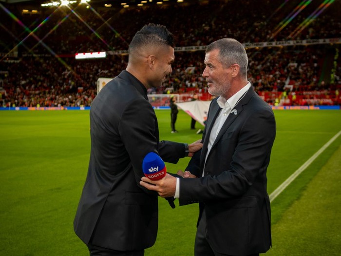 MANCHESTER, ENGLAND - AUGUST 22:  New signing Casemiro of Manchester United speaks to Roy Keane prior to the Premier League match between Manchester United and Liverpool FC at Old Trafford on August 22, 2022 in Manchester, United Kingdom. (Photo by Ash Donelon/Manchester United via Getty Images)