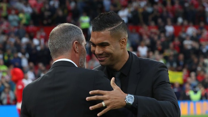 MANCHESTER, ENGLAND - AUGUST 22: Casemiro of Manchester United greets Roy Keane ahead of the Premier League match between Manchester United and Liverpool FC at Old Trafford on August 22, 2022 in Manchester, England. (Photo by Tom Purslow/Manchester United via Getty Images)