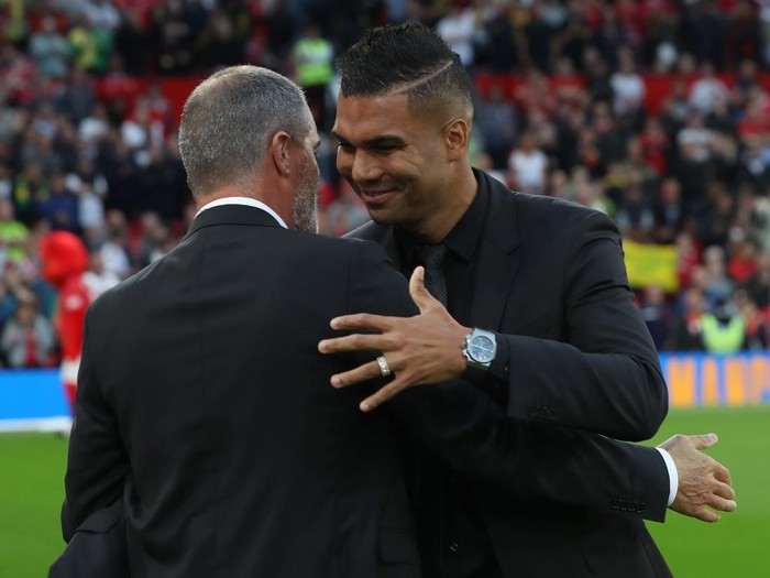 MANCHESTER, ENGLAND - AUGUST 22: Casemiro of Manchester United greets Roy Keane ahead of the Premier League match between Manchester United and Liverpool FC at Old Trafford on August 22, 2022 in Manchester, England. (Photo by Tom Purslow/Manchester United via Getty Images)