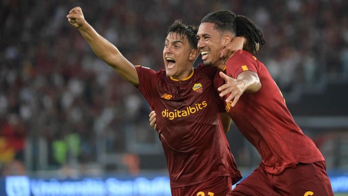 ROME, ITALY - AUGUST 22: AS Roma players Paulo Dybala and Chris Smalling celebrate during the Serie A match between AS Roma and US Cremonese at Stadio Olimpico on August 22, 2022 in Rome, Italy. (Photo by Luciano Rossi/AS Roma via Getty Images)