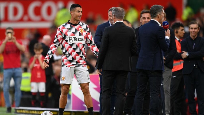 MANCHESTER, ENGLAND - AUGUST 22: Cristiano Ronaldo of Manchester United interacts with Sky Sports Pundit, Roy Keane prior to the Premier League match between Manchester United and Liverpool FC at Old Trafford on August 22, 2022 in Manchester, England. (Photo by Michael Regan/Getty Images)