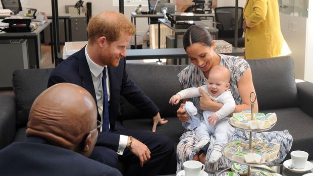 Britain's Duke and Duchess of Sussex, Prince Harry and his wife Meghan hold their baby son Archie as they meet with Archbishop Desmond Tutu at the Tutu Legacy Foundation  in Cape Town on September 25, 2019. - The British royal couple are on a 10-day tour of southern Africa -- their first official visit as a family since their son Archie was born in May. (Photo by HENK KRUGER / POOL / AFP)        (Photo credit should read HENK KRUGER/AFP via Getty Images)