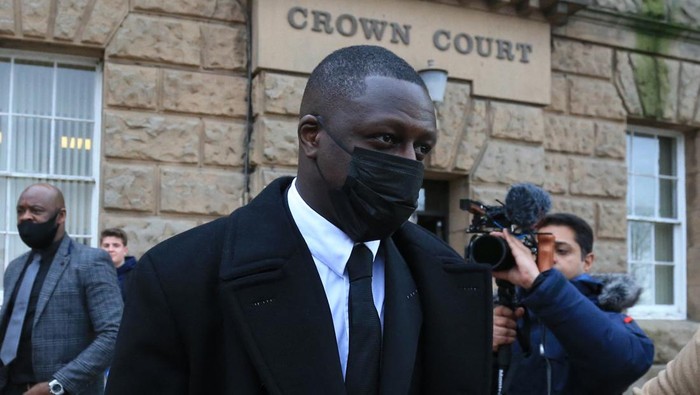 Manchester City and France international footballer Benjamin Mendy (C) leaves after a pre-trial hearing at Chester Crown Court in Chester, northwest England, on February 2, 2022. - Mendy, who has been charged with seven counts of rape, was freed on bail last month with stringent conditions, including the surrender of his passport. Mendy, who is accused by five women of seven counts of rape and one of sexual assault, has been in custody since being arrested and charged on August 26 last year. (Photo by Lindsey Parnaby / AFP) (Photo by LINDSEY PARNABY/AFP via Getty Images)