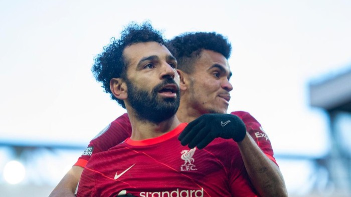 LIVERPOOL, ENGLAND - FEBRUARY 19: Mohamed Salah of Liverpool celebrates scoring his teams second goal and his one hundred and fiftieth for the club with team mate Luis Diaz  during the Premier League match between Liverpool and Norwich City at Anfield on February 19, 2022 in Liverpool, United Kingdom. (Photo by Joe Prior/Visionhaus via Getty Images)