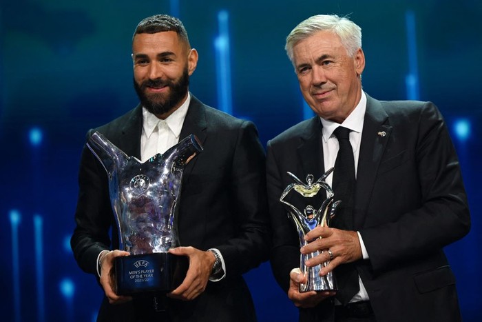 Real Madrids French forward Karim Benzema poses with his 