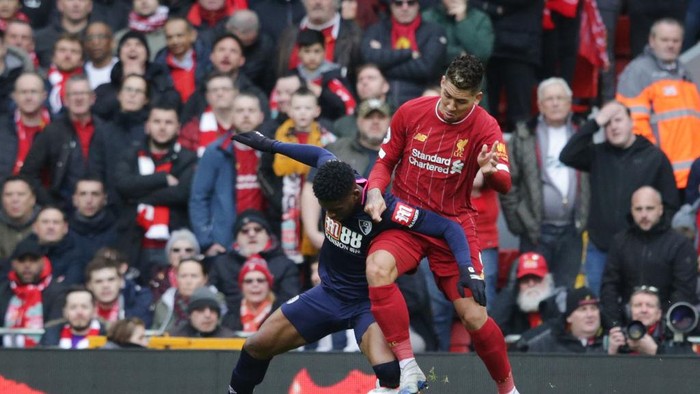 LIVERPOOL, ENGLAND - MARCH 07: Jefferson Lerma of Bournemouth and Roberto Firminho of Liverpool during the Premier League match between Liverpool FC and AFC Bournemouth  at Anfield on March 07, 2020 in Liverpool, United Kingdom. (Photo by Robin Jones - AFC Bournemouth/AFC Bournemouth via Getty Images)