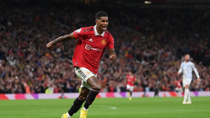 MANCHESTER, ENGLAND - AUGUST 22: Marcus Rashford of Manchester United celebrates scoring a goal to make it 2-0 during the Premier League match between Manchester United and Liverpool FC at Old Trafford on August 22, 2022 in Manchester, England. (Photo by Michael Regan/Getty Images)
