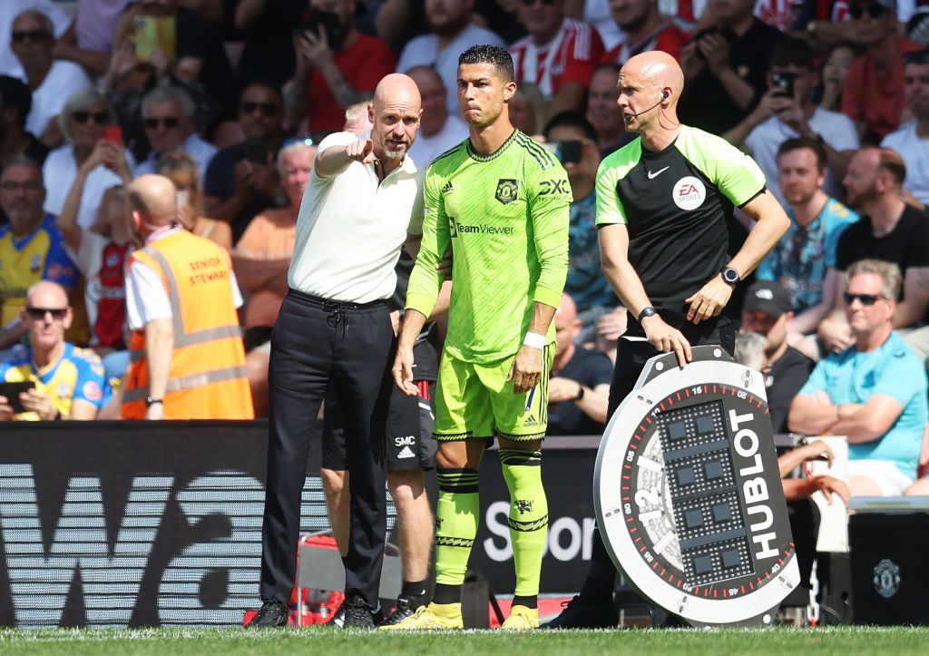 SOUTHAMPTON, ENGLAND - AUGUST 27: Erik ten Hag speaks to Cristiano Ronaldo of Manchester United before they are substituted on during the Premier League match between Southampton FC and Manchester United at Friends Provident St. Mary's Stadium on August 27, 2022 in Southampton, England. (Photo by Manchester United/Manchester United via Getty Images)