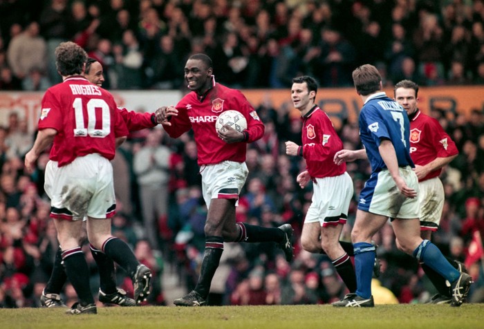 Manchester United vs Ipswich Town MANCHESTER, ENGLAND - MARCH 04: Manchester United striker Andrew Cole is congratulated by team mates after scoring the third of his five goals during the 9-0 Premier League match against Ipswich Town at Old Trafford on March 4th, 1995 in Manchester, United Kingdom. (Photo by Anton Want/Allsport/Getty Images/Hulton Archive)