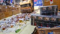 Jutaan Batang Rokok Dibakar, Ribuan Miras Dilindas Alat Berat