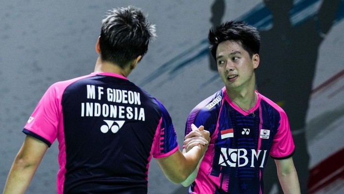 Marcus/Kevin lolos ke 16 besar Japan Open 2022. Foto: Getty Images/Shi Tang
