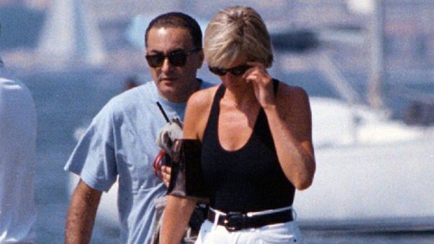 Diana, Princess of Wales, right, and her companion Dodi Fayed, walk on a pontoon in the French Riviera resort of St. Tropez, Aug. 22, 1997. The story of Princess Diana's death at age 36 in that catastrophic crash in a Paris traffic tunnel continues to shock, even a quarter-century later. (Patrick Bar/Nice Matin via AP)