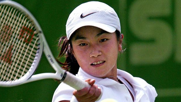 Indonisian player Wynnw Adiati Prakusya sends a forehand to Japanese Miho Saeki  during their final game in women's tennis team competition  05 October 2002 at Geumjeong court during the 14th Asian Games in Busan. Saeki won the first set 7-6 (7/4).    AFPPHOTO/Marwan NAAMANI (Photo by MARWAN NAAMANI / AFP)